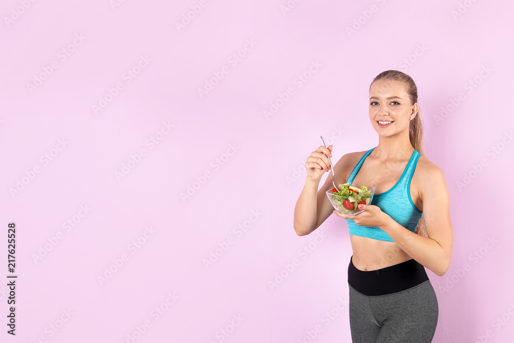 Young woman with salad on color background. Healthy diet Young woman with salad on color background. Healthy diet