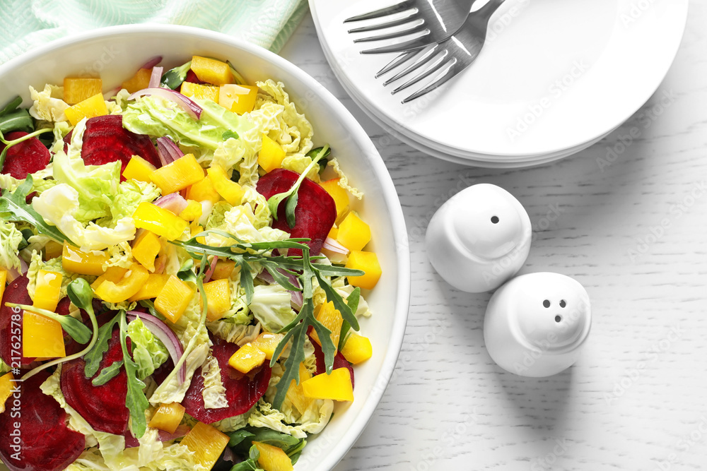 Bowl with tasty beets salad on table, closeup Bowl with tasty beets salad on table, closeup