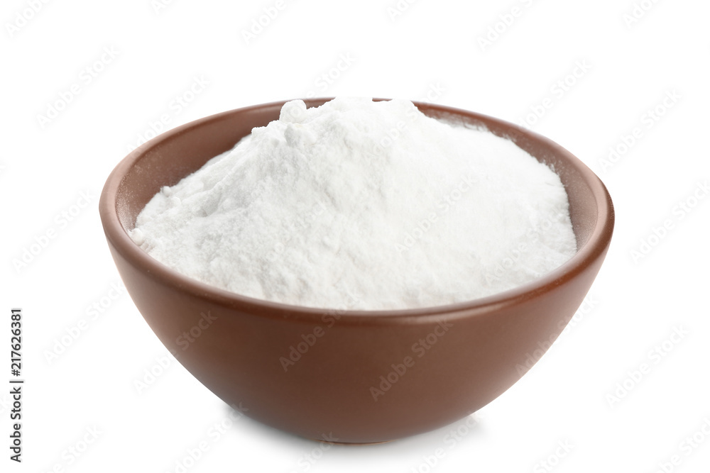 Bowl with baking soda on white background