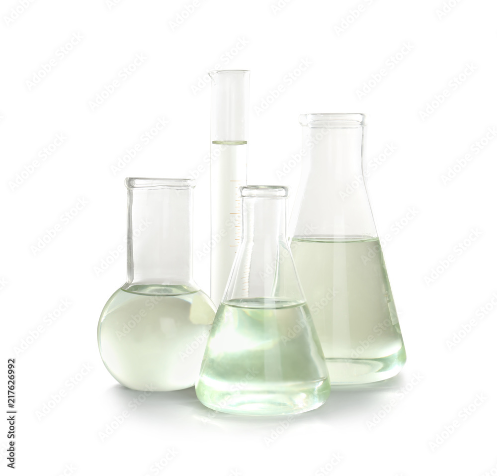 Laboratory glassware with liquid on white background. Chemical analysis Laboratory glassware with liquid on white background. Chemical analysis