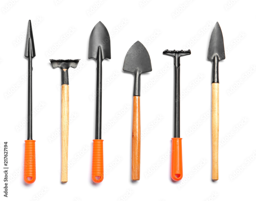 Set of gardening tools on white background, top view