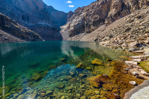 Summer Alpine Lake - Clear and colorful Chasm Lake surrounded by steep mountain ridges, Rocky Mountain National Park, Colorado, USA. 