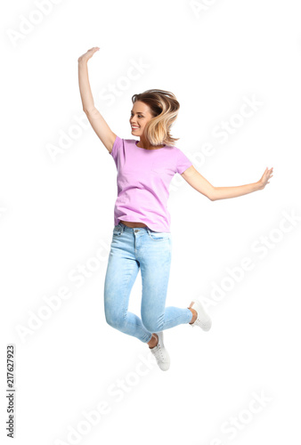 Beautiful woman jumping on white background