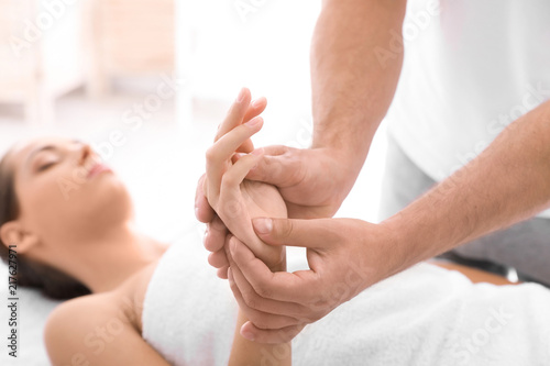 Obraz na plátne Young woman receiving massage in salon, closeup