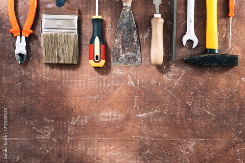 Different working tools on wooden rustic background. top view with copy space. photo