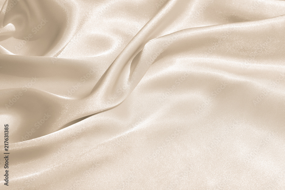 The texture of the satin fabric of beige color for the background  - obrazy, fototapety, plakaty 
