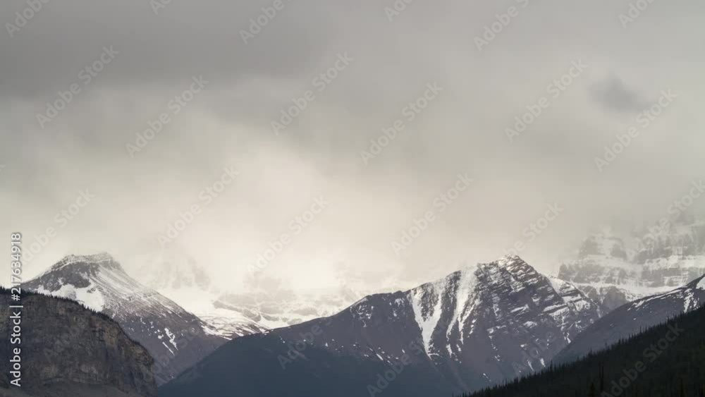 Time lapse of storm clouds above mountain peak in the Canadian Rockies, Alberta Canada Time lapse of storm clouds above mountain peak in the Canadian Rockies, Alberta Canada