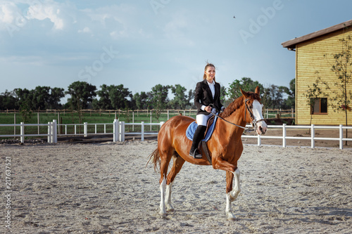 Rider elegant woman riding her horse outside © producer