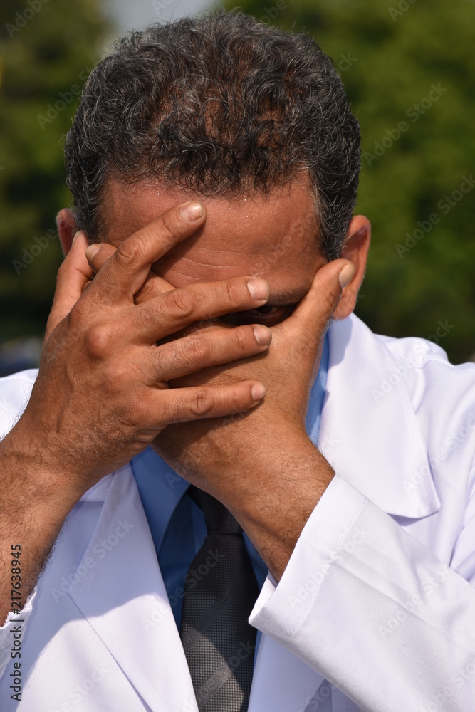 Hopeless Male Medical Professional Wearing Lab Coat