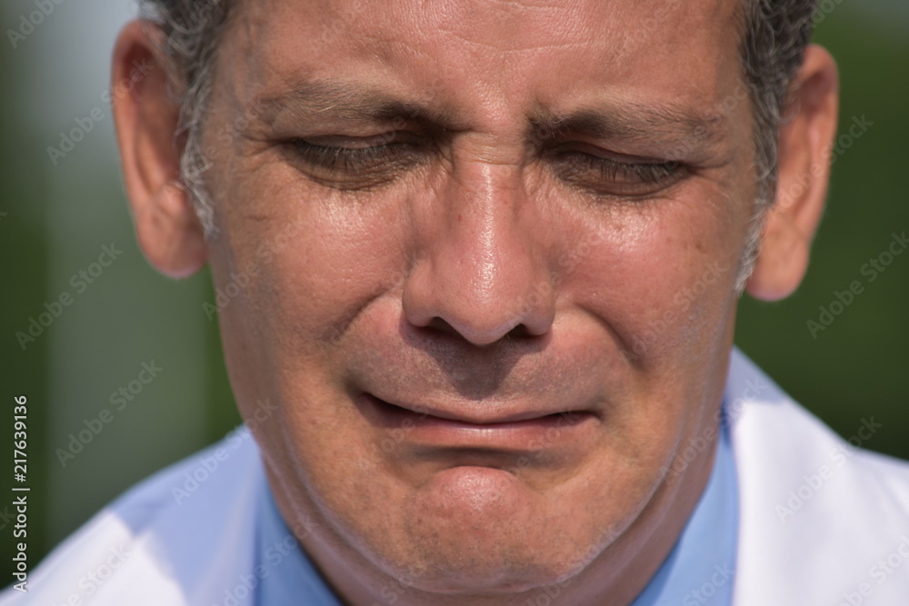 Depressed Male Surgeon Wearing Lab Coat Depressed Male Surgeon Wearing Lab Coat