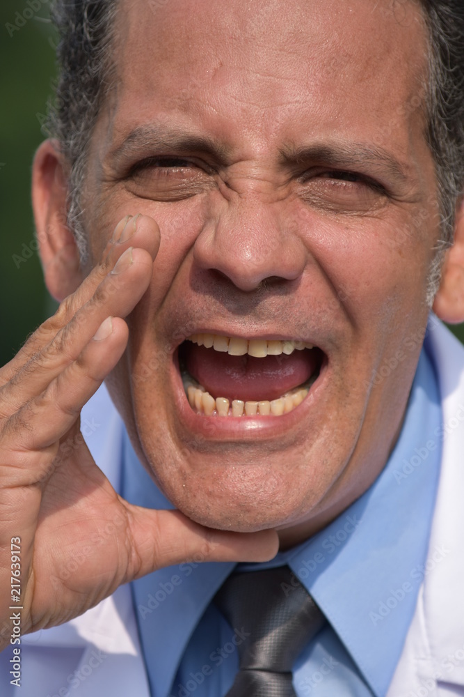 Fototapeta premium Colombian Male Doctor Yelling Wearing Lab Coat