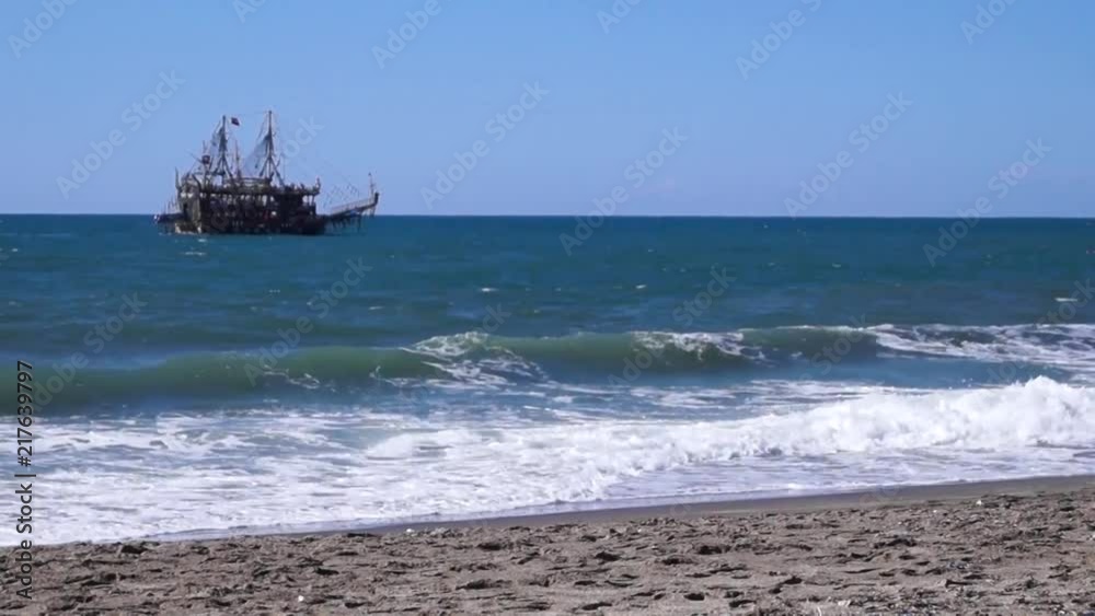 The ship floats by sea