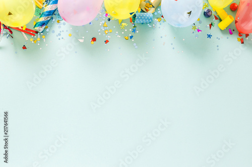 Flat lay decoration party concept pastel blue border top view