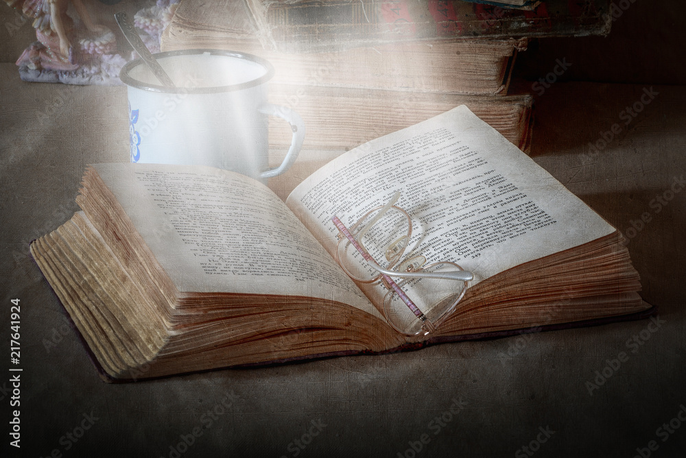 Fototapeta premium book on the table in the daylight in the sunlight