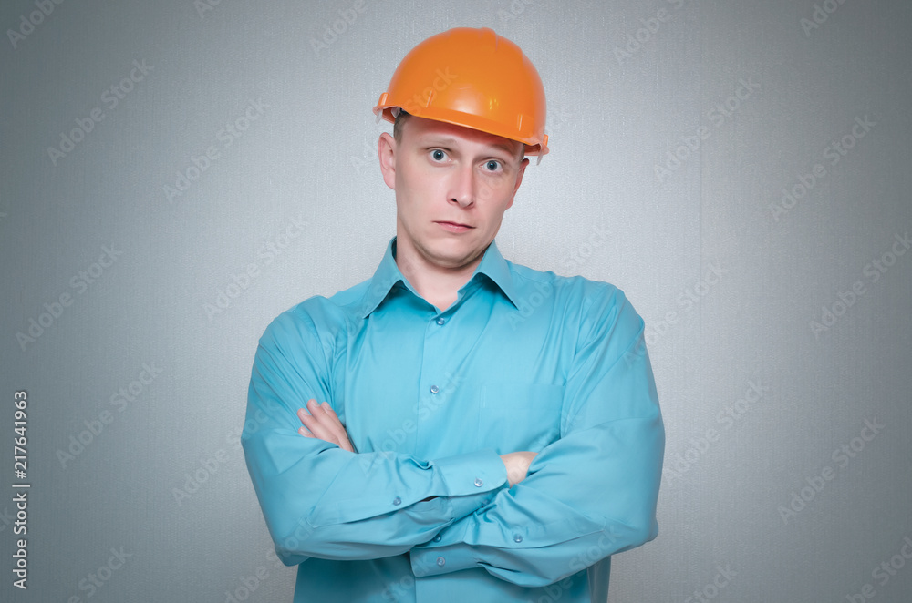 Guilty builder worker isolated on gray background. Guilty builder worker isolated on gray background.
