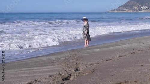 The girls goes along the seashore photo