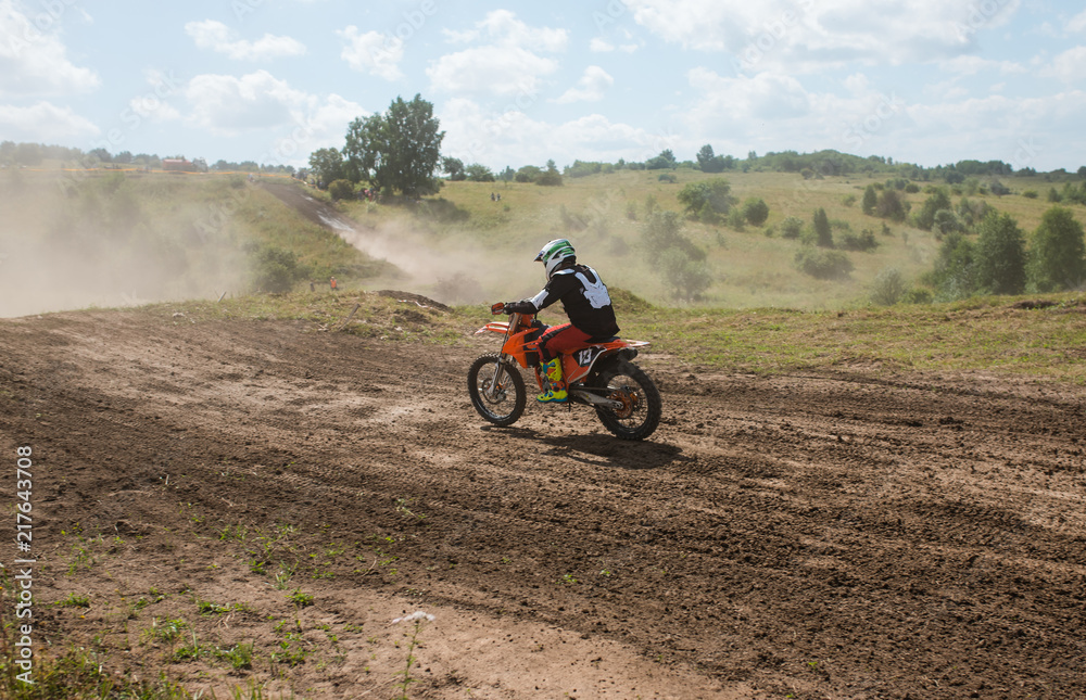 A picture of a biker doing a trick, and jumping into the air. Motocross Championship. sports fast driving. bike large small. A picture of a biker doing a trick, and jumping into the air. Motocross Championship. sports fast driving. bike large small.