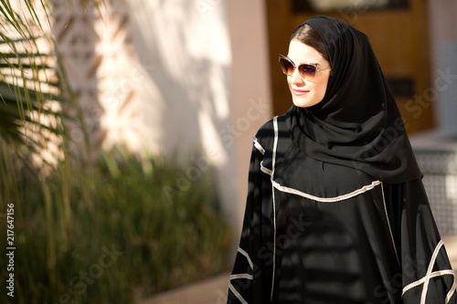 Arab woman looking away.