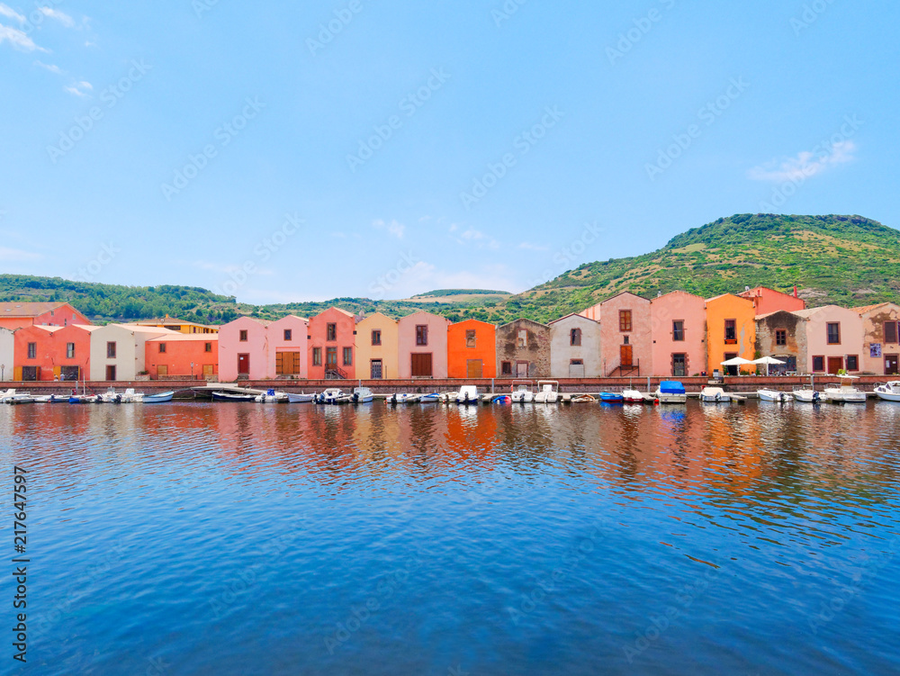 Fototapeta premium River embankment in the city of Bosa with colorful, typical Italian houses. province of Oristano, Sardinia, Italy.