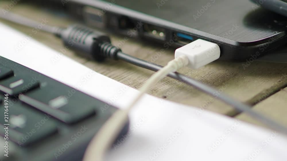 Closeup of USB flash drive inserted into port on the side of a laptop Closeup of USB flash drive inserted into port on the side of a laptop