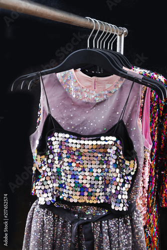 sequins colorful vest with sundress ,clothing on hanger- black background 