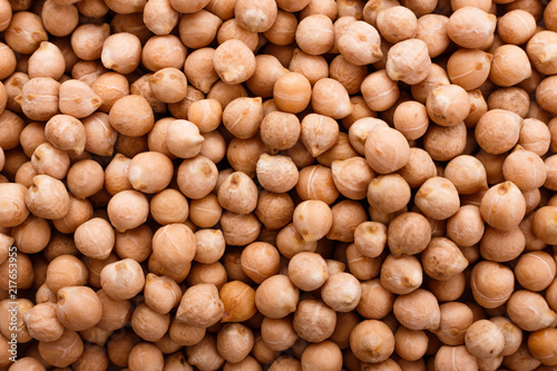 uncooked chickpeas on a white acrylic background