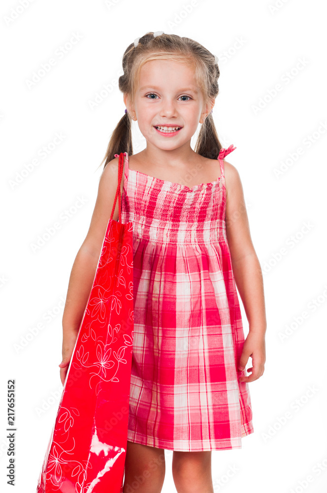 Adorable litle girl with red shopping bag isolated on a white background Adorable litle girl with red shopping bag isolated on a white background