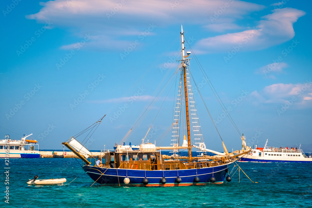 Beautiful wooden boat on water in Mykonos, Greese