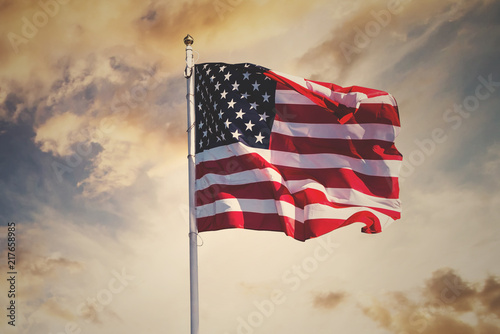 american flag waving in the sky, toned wth instagram filter photo