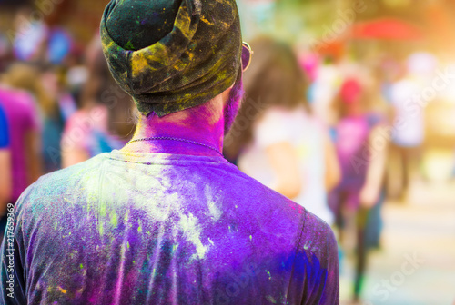 Colourful man on holi festival, backview
