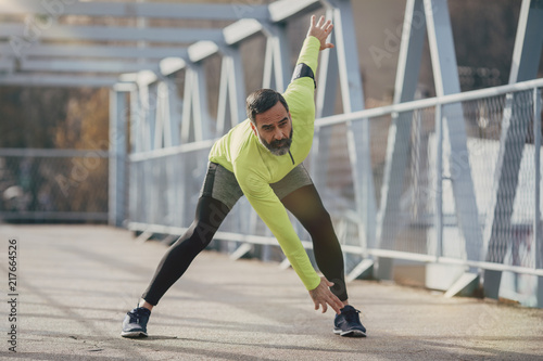 A Man Runner Doing Stretching Exercise
