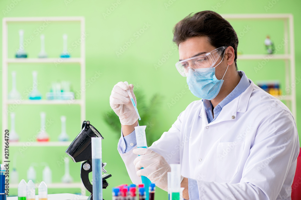 Man chemist working in the lab Man chemist working in the lab