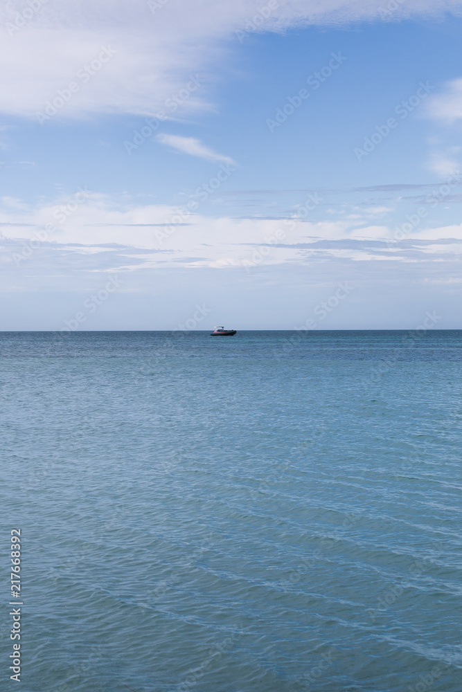 Boat out on calm ocean