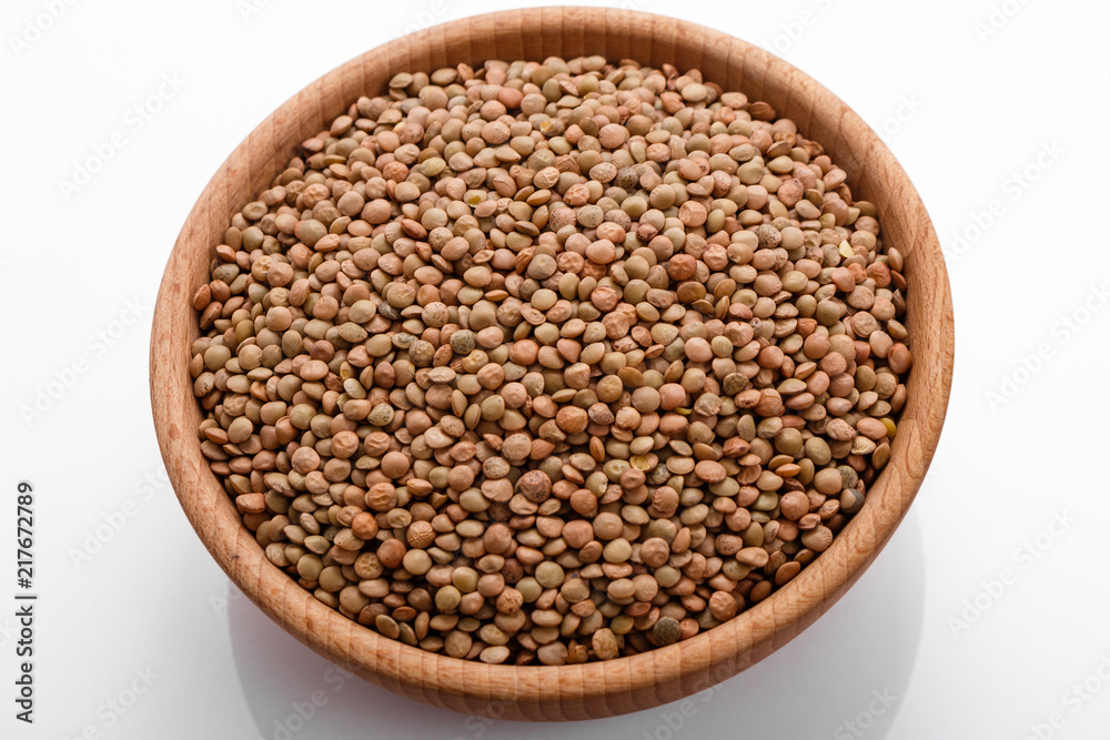 raw lentils on a white acrylic background raw lentils on a white acrylic background