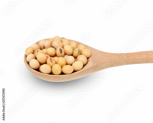 Soybeans in  wooden spoon isolated on white background.