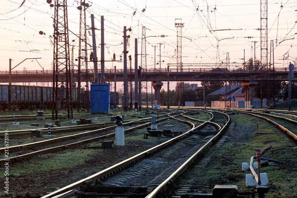 Railway pointwork, railway tracks on the station at summer sunset. Transportation Railway pointwork, railway tracks on the station at summer sunset. Transportation