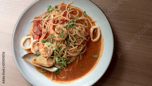 Seafood spaghetti with shrimp  mussels and squid White plate on the table