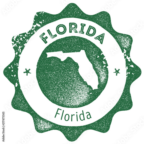 Florida map vintage stamp. Retro style handmade label, badge or element for travel souvenirs. Dark green rubber stamp with US state map silhouette. Vector illustration.