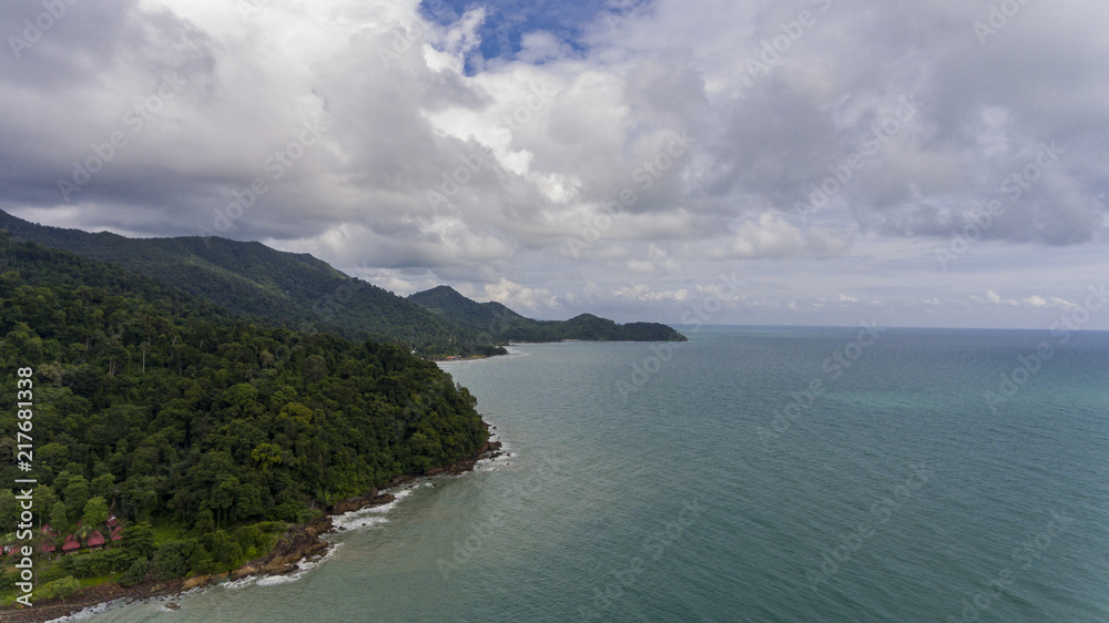 Aerial view of Koh Chang with green trees and blue water.