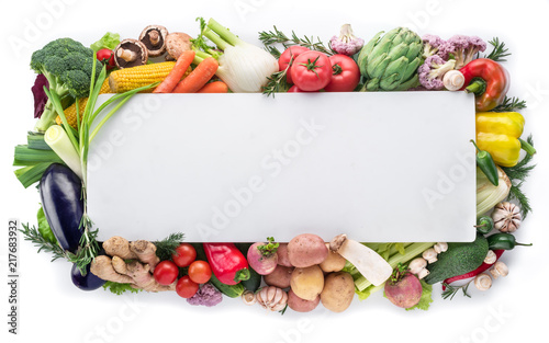 Fototapeta Naklejka Na Ścianę i Meble -  Different colorful vegetables arranged as a frame on white background.