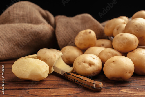 Pile of potatoes lying on wooden boards