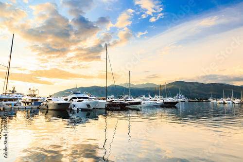 Luxury yacht marina. Port in Mediterranean sea at sunset.