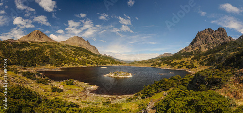 View on the lake and mountains around on the southernmost trek in the world in Dientes de Navarino in Isla Navarino, Patagonia, Chile photo