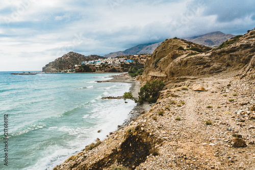 Crete  Greece. beach with rocks and cliffs with view towards sea ovean on a sunny day.