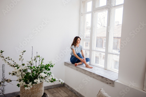 Beautiful girl by the window.
