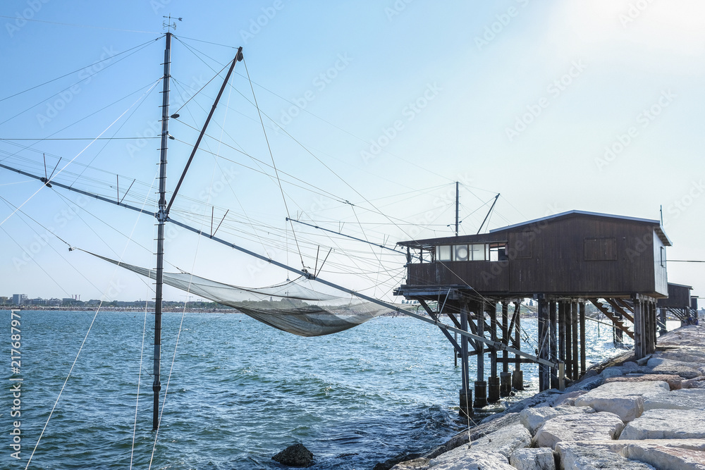 Sottomarina, Italy - July, 1, 2018: fishing houses on a sea coast in Sottomarina, Italy