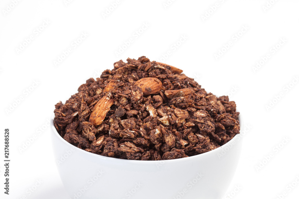Close up Granola on white bowl isolated on white background. Close up Granola on white bowl isolated on white background.