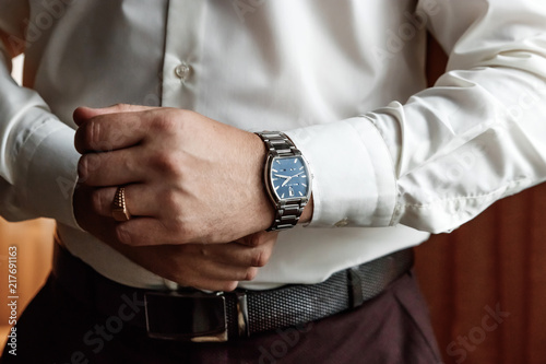 guy in the shirt adjusts the watch, accessories male look © Aliaksandr Marko