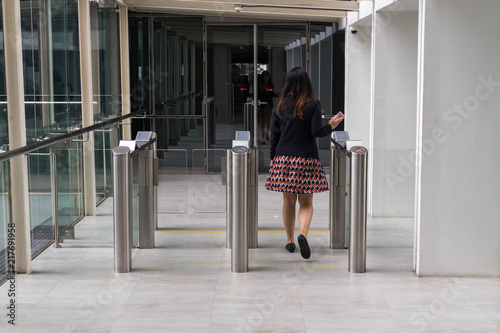 women walking to entrance gate security with key card access control smart office building