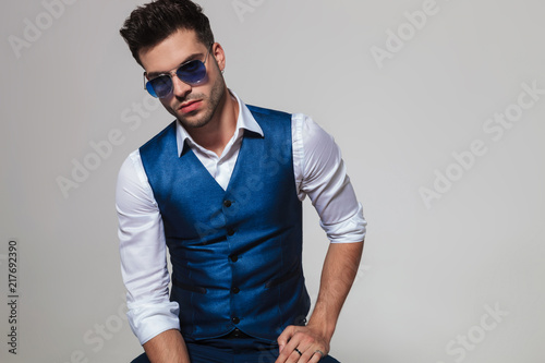 Slika na platnu portrait of sexy man wearing a blue waistcoat and sunglasses